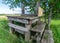 Landscape with old wooden sticks, old wooden structure, historical milk jug collection place