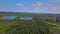 Landscape panorama, blue water in a forest lake with trees sky panorama