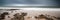 Landscape panorama long exposure image of rocks and sandy beach