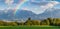 Landscape Panorama with Rainbow and Mountains