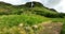 Landscape panorama on summer Hengifoss waterfall in Iceland among grassland