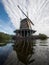 Landscape panorama of typical traditional old windmill in Zaanse Schans river canal Zaandijk Amsterdam Netherlands