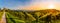 Landscape panorama of vineyard on an Austrian countryside with a church in the background in Kitzeck im Sausal