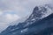 Landscape with peaks engulfed in clouds and misty forests