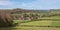 Landscape photo of the characterful village of Fingest in the Chiltern Hills, surrounded by farming land.