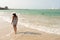 Landscape photo at Palmarito beach on Tierra Bomba island, Colombia. And a female model walking