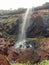 a landscape photo of sawatsada waterfall in konkan.