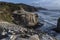 Landscape photo at  sunset sunrise showing the cliffs  along the coastline of New Zealands north island at Muriwai beach, with