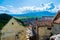 Landscape photo taken from the Rasnov Citadel showing the Rasnov city and the mountains in the distance - Rasnov, Brasov country,