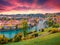 Landscape photography. Fantastic evening view of Bern town with Pont de Nydegg bridge and Nydeggkirche - Protestant church on back