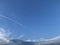 Landscape of plane tracks on a blue sky during a sunny day