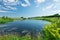 Landscape with pond and hills