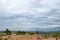 Landscape in prairie under cloudy sky with a shelter