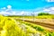 Landscape. Railroad in rural area in summer. Digital painting