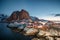 Landscape of Red house fishing village with mountain at sunrise