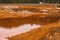 Landscape with red soil polluted copper mining factory in Karabash, Russia, Chelyabinsk region