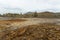 Landscape with red soil polluted copper mining factory in Karabash, Russia, Chelyabinsk region