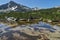 Landscape with Reflection of Sivrya peak in Banski lakes, Pirin Mountain