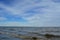 Landscape with river and blue sky with cirrus white clouds