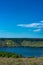 Landscape of river with Rocky Mountains. Summer Travel view