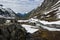 Landscape with river, snow and mountains. View from old Strynefjell mountain road, Norway