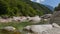 Landscape with river in summer, with big gray boulders