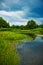 Landscape. River, trees, sky.