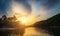 Landscape of river view during the sunrise time with many colorful camping tent at campsite