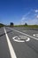 Landscape with road signs `Bicycle path` on the asphalt