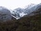 Landscape of rock, snow and green