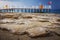 Landscape of rocky turkish beach on blue sea with pier, Konakli Turkey. seascape of stone beach in the morning.