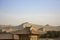 Landscape with rooftops and Singing Sand Mountain, Taklamakan De