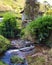 Landscape of a rural environment where there are mountains, river and trees. Bucolic countryside landscape