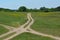 Landscape with rural roads in meadow