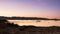 landscape with a sailboat sailing at sunset on the shores of an island Galicia