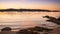 Landscape with a sailboat sailing at sunset on the shores of an island Galicia