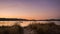 Landscape with a sailboat sailing at sunset on the shores of an island Galicia