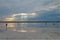 Landscape of salty estuary with a girl photographing abstract art objects