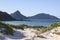 Landscape with sand dunes ocean islands and hills. Fingal Bay. P