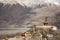 Landscape and sandstorm cyclone with 32 metre statue of Maitreya Buddha near Diskit Monastery at nubra village at Leh Ladakh India