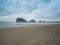 Landscape of sandy beach on the mysterious island with the morning fog