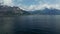 Landscape scene of Como Lake mountains with cloudy sky in Italy