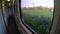 Landscape scenery fields and mountains from window of railway train