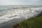 Landscape by the sea, choppy water, lowering sky