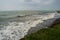 Landscape by the sea, choppy water, lowering sky