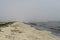 Landscape with seagulls,  sea view with breakwaters,  waves and sea shells,  clouds,  photographed in Gura Portitei,  Romania,  in