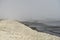 Landscape with seagulls,  sea view with breakwaters,  waves and sea shells,  clouds,  photographed in Gura Portitei,  Romania,  in