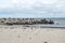 Landscape with seagulls,  sea view with breakwaters,  waves and sea shells,  clouds,  photographed in Gura Portitei,  Romania,  in