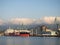 Landscape in the seaport. Port in the Caucasus. Ships and mountains. Clouds over the mountains. Port in Batumi. Logistics. Black