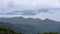 Landscape and seascape mountain and the sea and shipping cargo containers in the rain season at viewpoint ngong ping 360 cable car